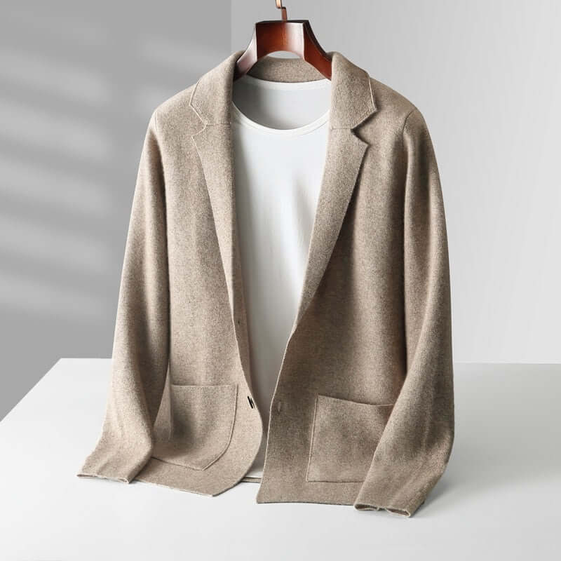 Beige Elijah chic blazer on a hanger with white t-shirt, showcasing timeless fashion, modern design, and effortless elegance.
