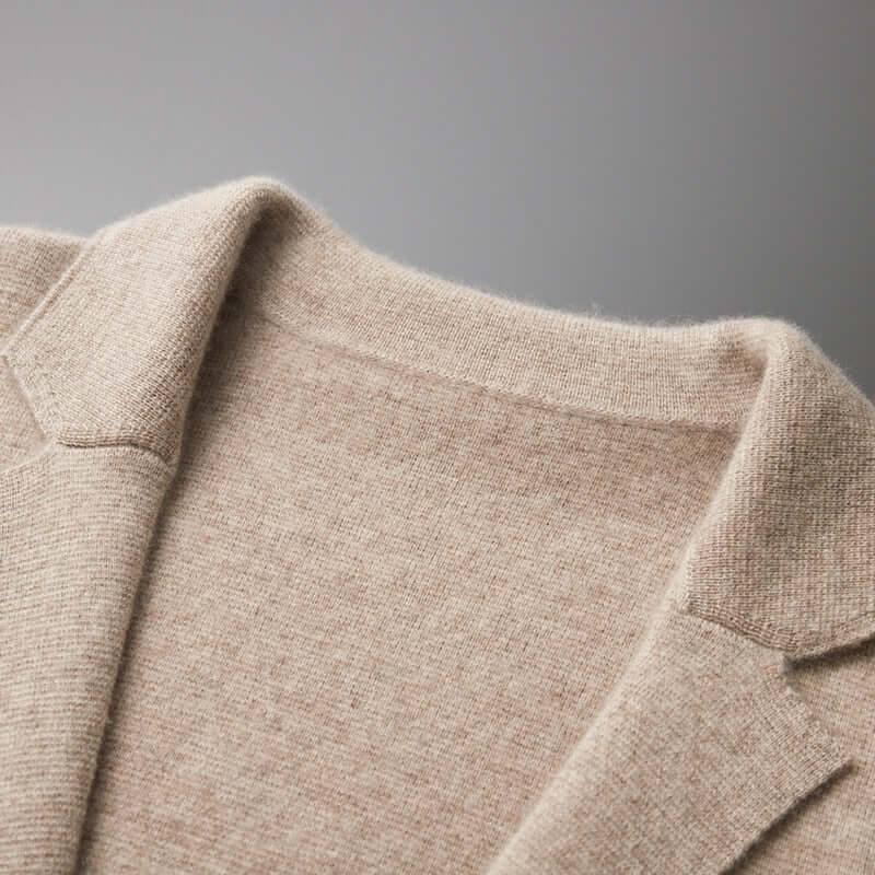 Close-up of collar on ELIJAH Chic Blazer, showcasing soft, breathable fabric and sophisticated design in beige color.