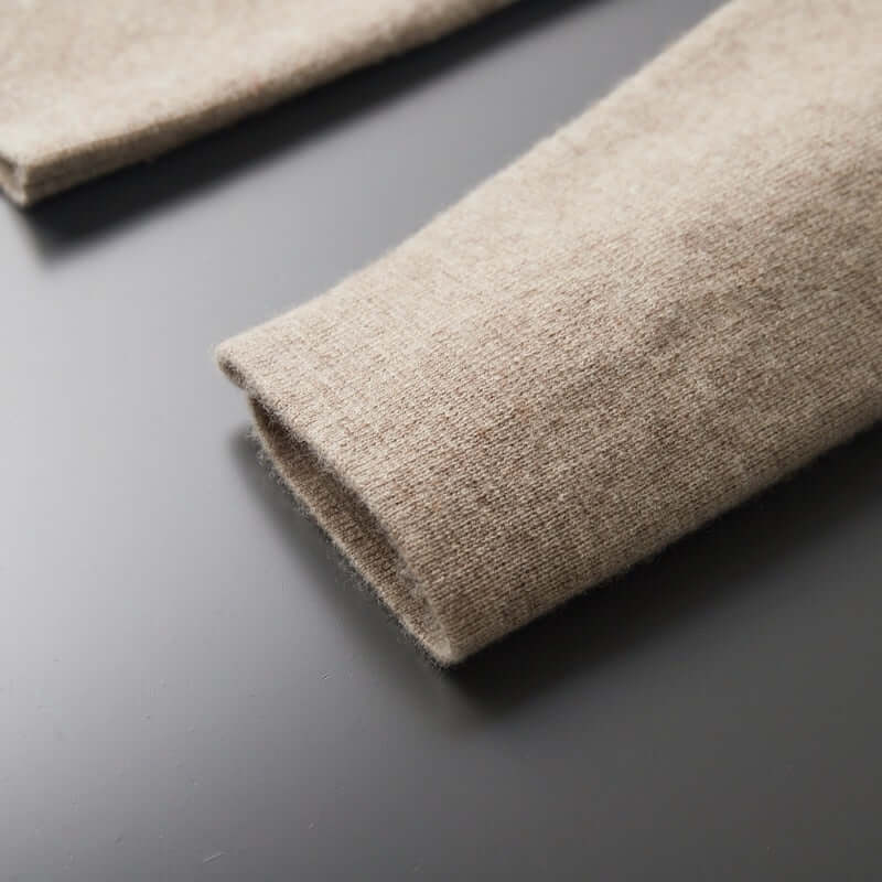 Close-up of the sleeve detail on the ELIJAH chic blazer in soft, breathable fabric on a dark background.