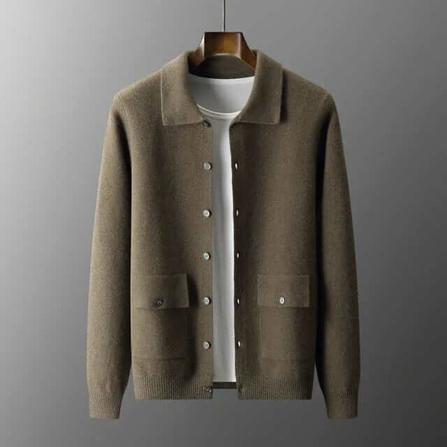 Luxurious ISAAC cashmere cardigan in brown displayed on a hanger, showcasing premium material and sophisticated design.