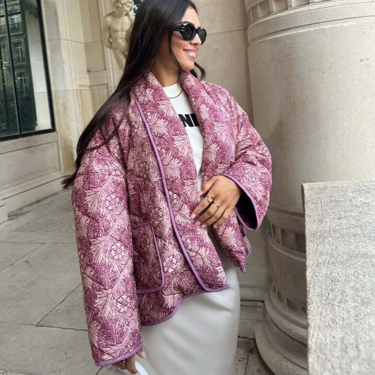Woman wearing stylish Swannie jacket with intricate patterns, perfect for autumn and versatile occasions.