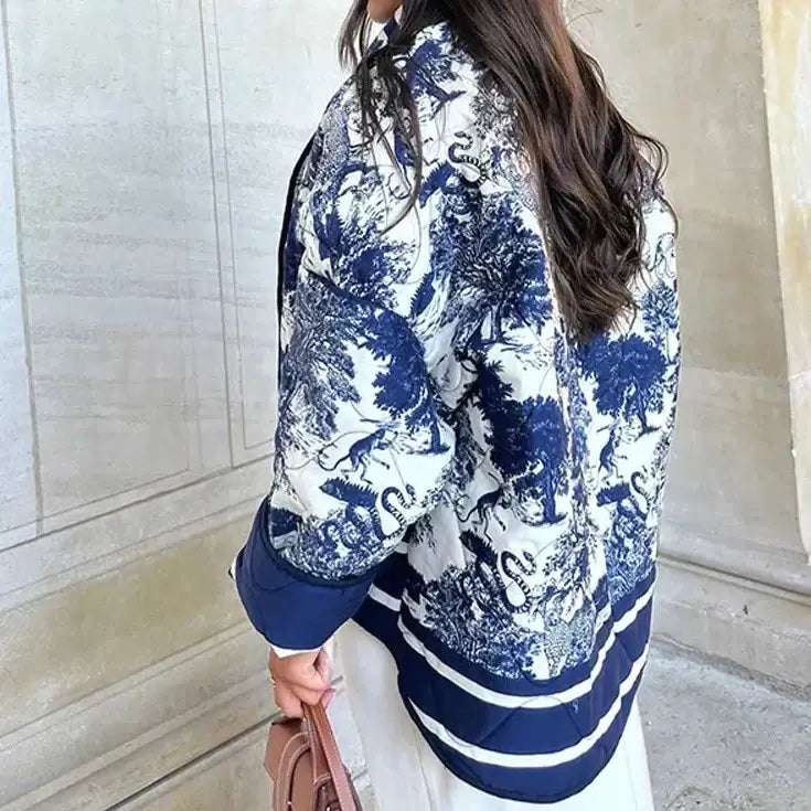 Woman wearing Swannie jacket with intricate design, perfect for autumn style and comfort.