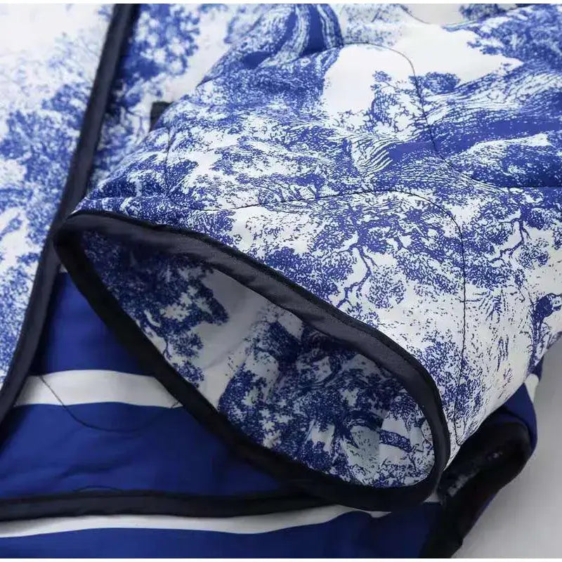 Close-up of Swannie Jacket with intricate blue and white print, showcasing its detailed design and quality craftsmanship.